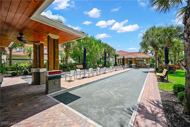 exterior space featuring ceiling fan