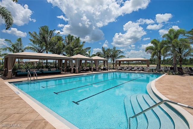 view of swimming pool featuring a patio area