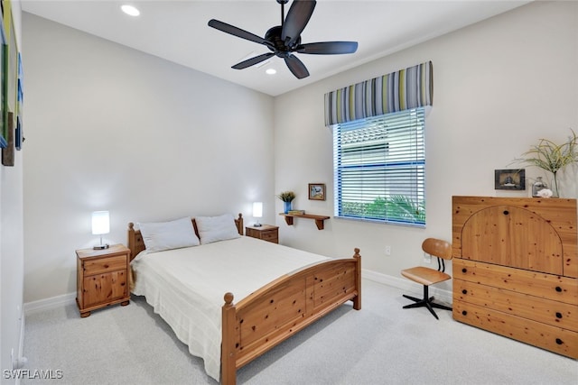 bedroom with ceiling fan and light colored carpet