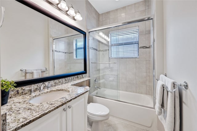 full bathroom with enclosed tub / shower combo, vanity, toilet, and tile patterned floors