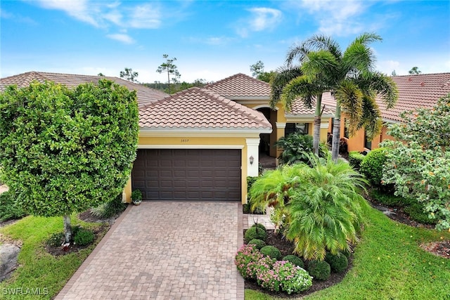 mediterranean / spanish-style house featuring a garage