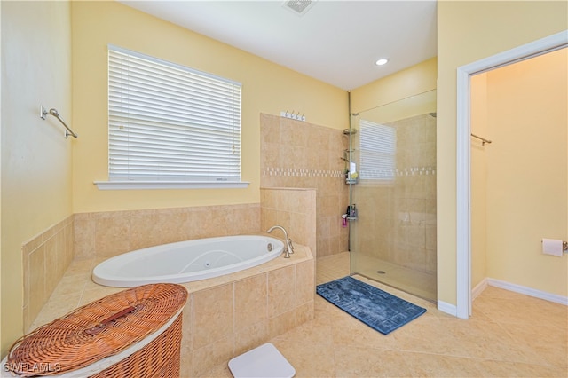 bathroom with tile patterned flooring and separate shower and tub