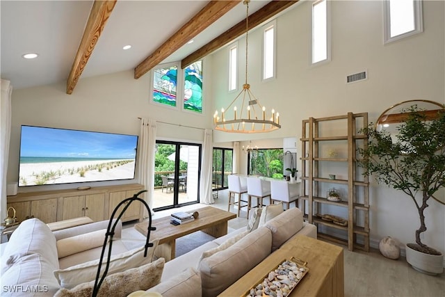 living area with high vaulted ceiling, visible vents, wood finished floors, a chandelier, and beamed ceiling