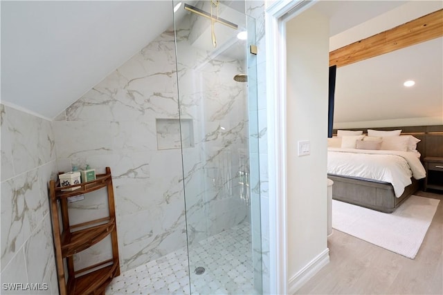 ensuite bathroom with vaulted ceiling, ensuite bath, a marble finish shower, and wood finished floors