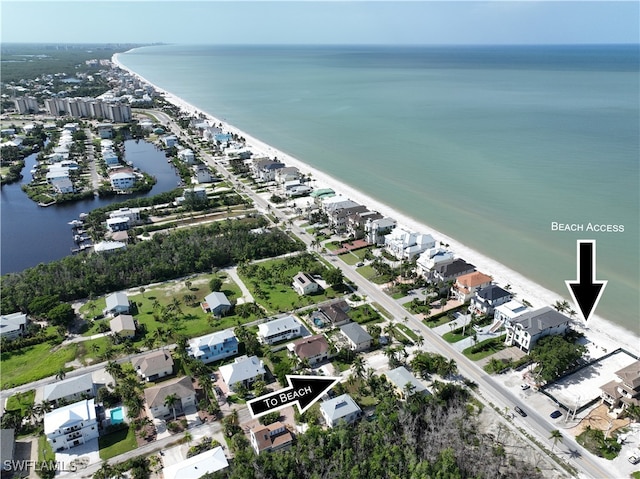 bird's eye view with a water view and a view of the beach