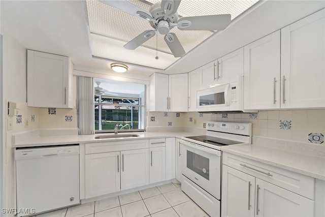 kitchen featuring white cabinets, white appliances, sink, ceiling fan, and decorative backsplash