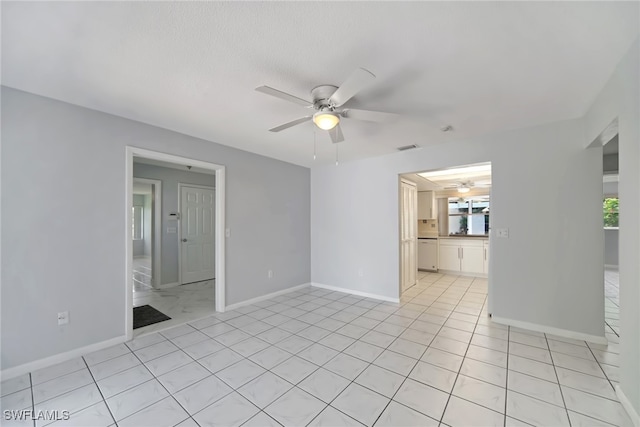 unfurnished room with a healthy amount of sunlight and ceiling fan