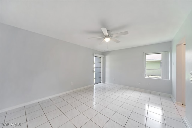 unfurnished room featuring ceiling fan and light tile patterned floors