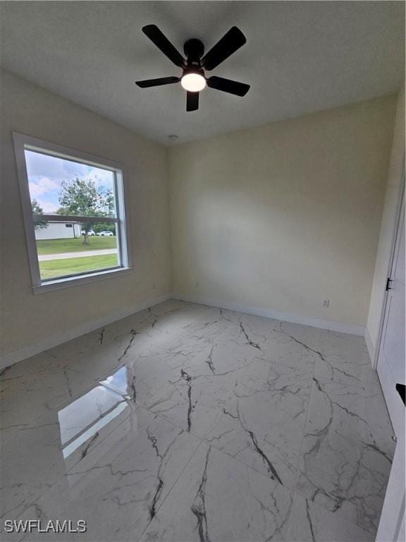 unfurnished room featuring ceiling fan