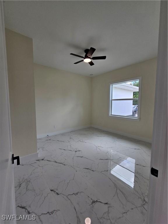 empty room featuring ceiling fan