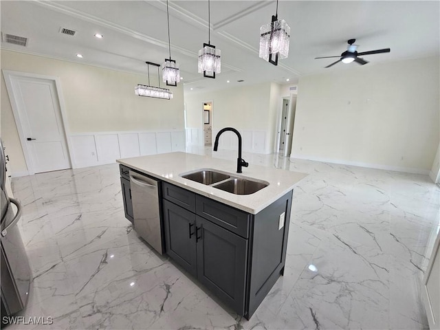 kitchen with pendant lighting, stainless steel dishwasher, a kitchen island with sink, and sink