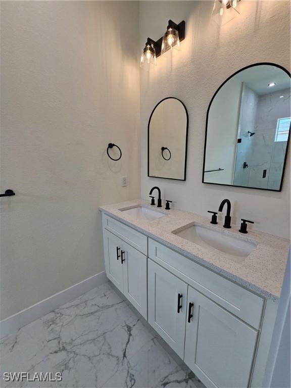 bathroom with vanity and walk in shower