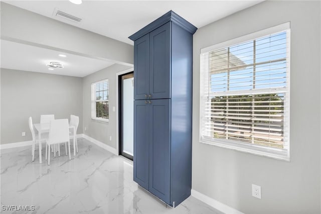 kitchen featuring blue cabinetry