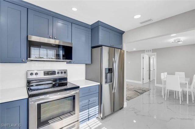 kitchen featuring appliances with stainless steel finishes and blue cabinets