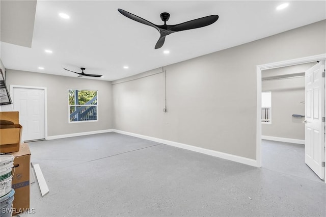 unfurnished living room with ceiling fan