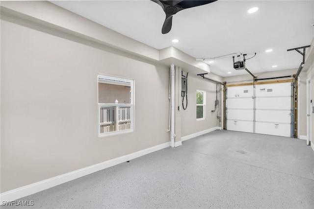 garage featuring a garage door opener and ceiling fan