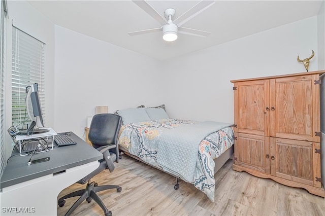 bedroom featuring light wood-type flooring and ceiling fan