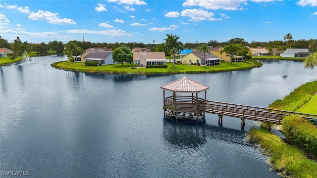 view of dock featuring a gazebo and a water view