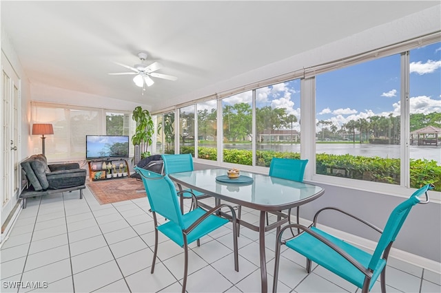 sunroom featuring ceiling fan