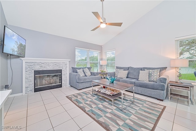 living room featuring ceiling fan, light tile patterned floors, and high vaulted ceiling