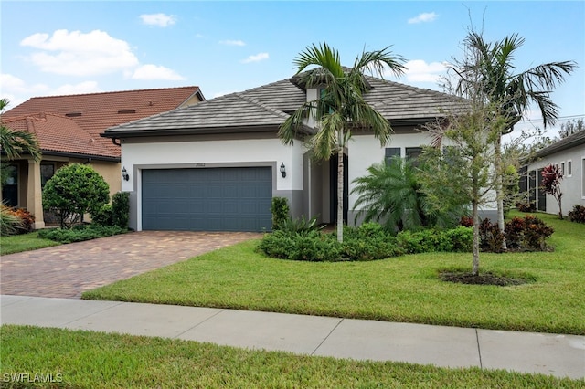 ranch-style house with a front lawn and a garage