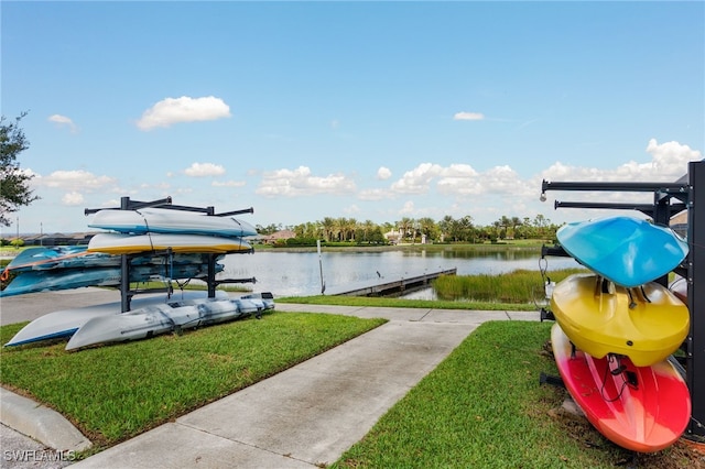 view of community featuring a yard and a water view