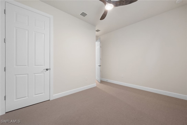 unfurnished bedroom with light carpet and ceiling fan