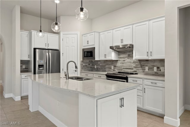 kitchen featuring a center island with sink, sink, decorative light fixtures, white cabinetry, and appliances with stainless steel finishes