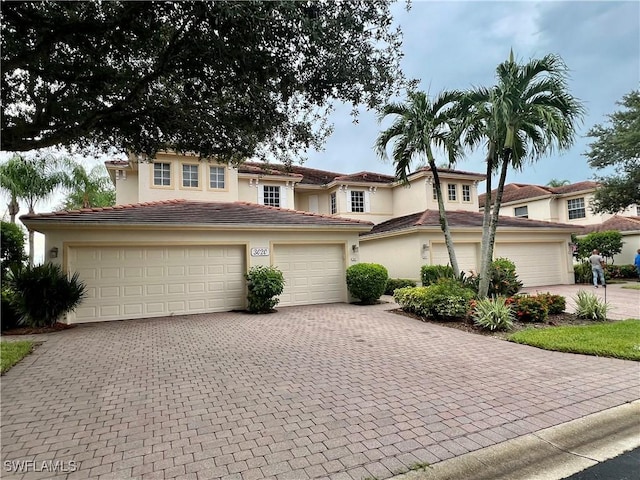 mediterranean / spanish-style home featuring a garage