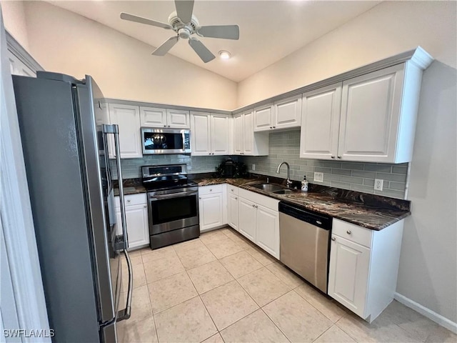 3020 Meandering Way Unit 201, Fort Myers, FL 33905 - kitchen with stainless steel appliances, backsplash, light tile patterned floors, a ceiling fan, and lofted ceiling