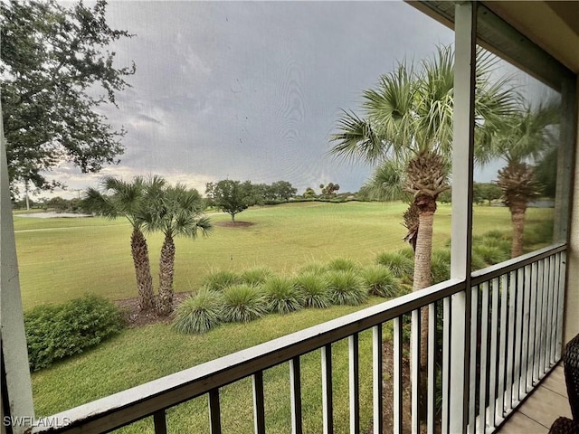 3020 Meandering Way Unit 201, Fort Myers, FL 33905 - view of green lawn featuring a balcony