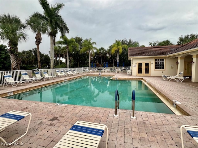 3020 Meandering Way Unit 201, Fort Myers, FL 33905 - community pool with french doors and a patio area