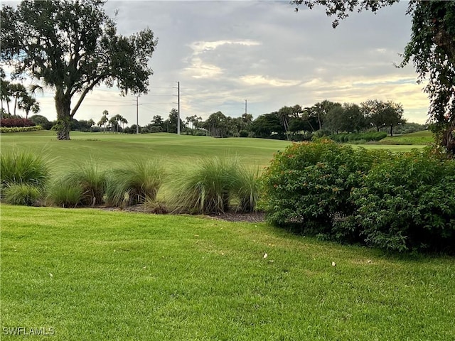 3020 Meandering Way Unit 201, Fort Myers, FL 33905 - view of home's community with a lawn and golf course view