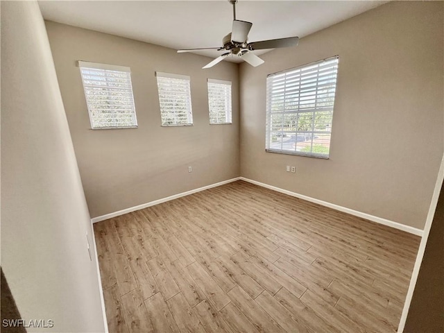 3020 Meandering Way Unit 201, Fort Myers, FL 33905 - unfurnished room with plenty of natural light, wood finished floors, and ceiling fan