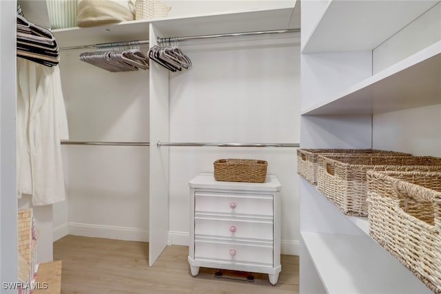 spacious closet featuring light wood-type flooring