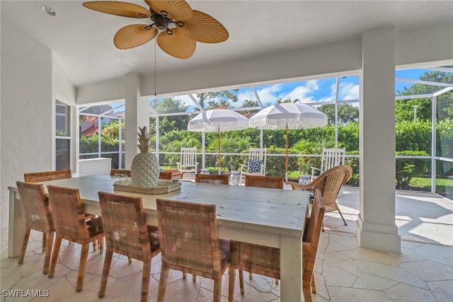 exterior space featuring ceiling fan, exterior bar, and a lanai