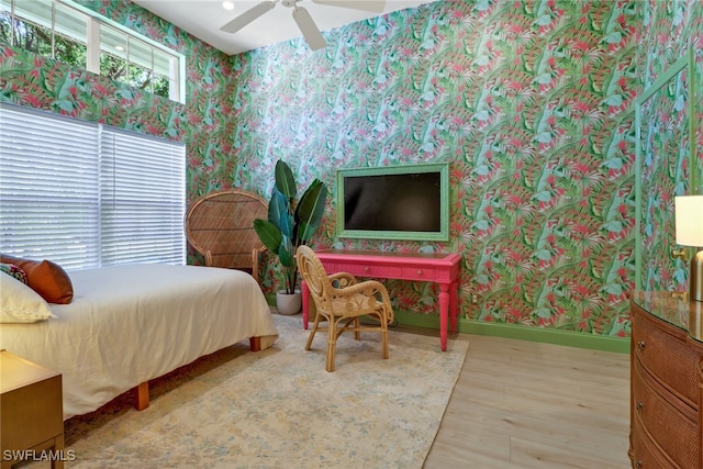 bedroom featuring ceiling fan and wood-type flooring