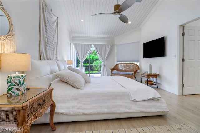 bedroom featuring ceiling fan, access to outside, light hardwood / wood-style floors, and lofted ceiling