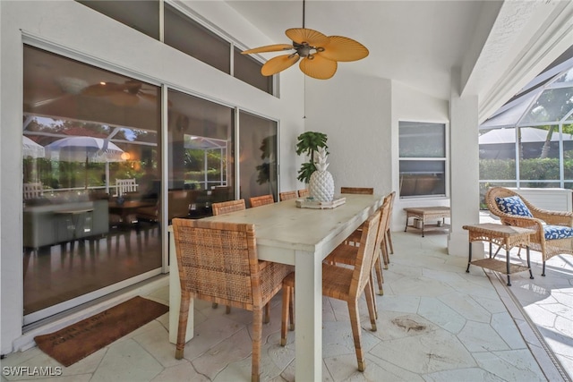 exterior space with ceiling fan and vaulted ceiling