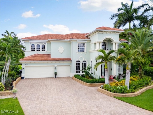 mediterranean / spanish-style house featuring a garage