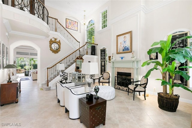 interior space with tile patterned flooring, a high ceiling, and a healthy amount of sunlight