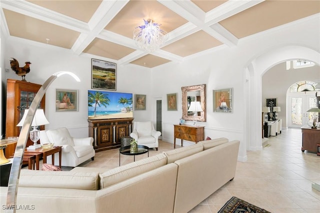 living room featuring beamed ceiling, light tile patterned floors, and coffered ceiling