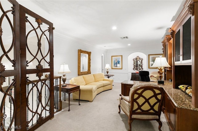 carpeted living room with crown molding