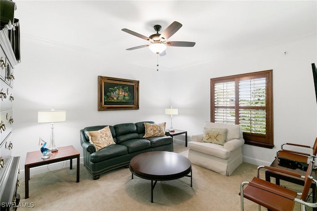 living room with carpet flooring, ceiling fan, and ornamental molding