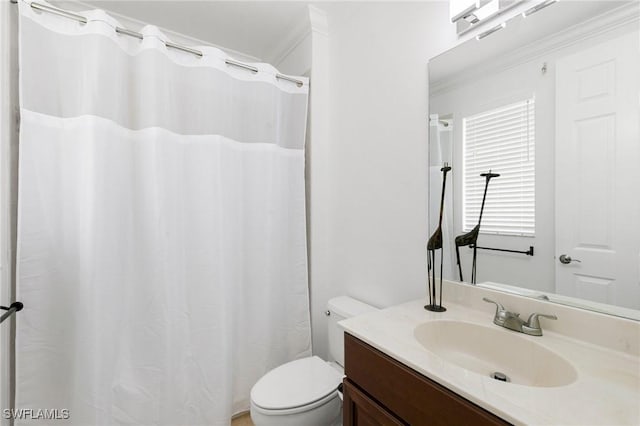 bathroom featuring vanity, toilet, and crown molding