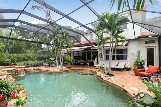 view of swimming pool featuring pool water feature, a lanai, and a patio area