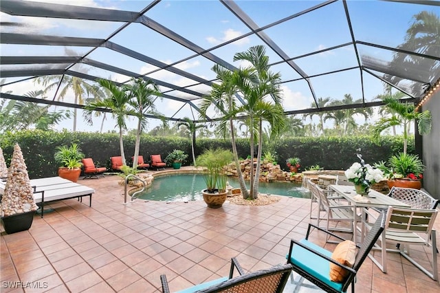 view of patio with pool water feature and a lanai