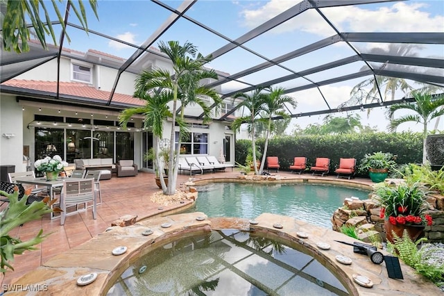 view of swimming pool featuring outdoor lounge area, glass enclosure, an in ground hot tub, and a patio