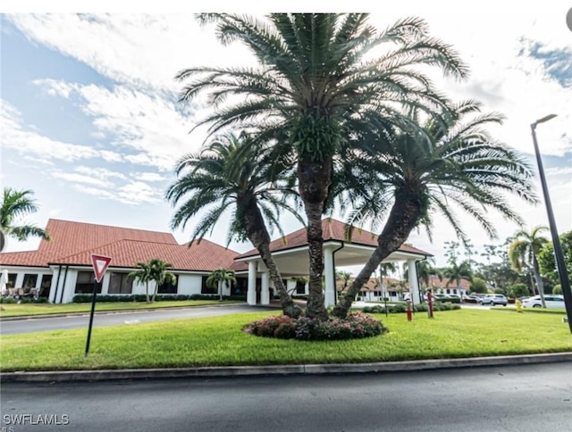 5975 Bloomfield Cir Unit C102, Naples, FL 34112 - exterior space featuring driveway and an attached garage