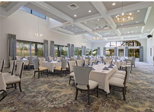 carpeted dining room featuring beam ceiling, coffered ceiling, a high ceiling, and a healthy amount of sunlight